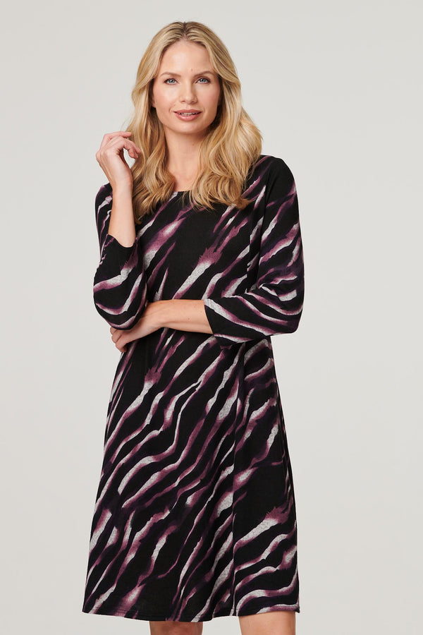 Purple | Printed Twist Back Skater Dress : Model is 5'10"/178 cm and wears UK10/EU38/US6/AUS10