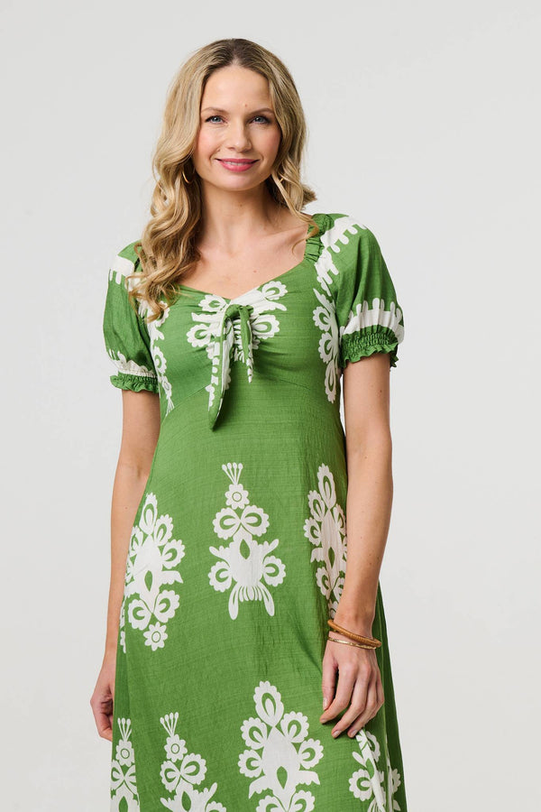 Green | Printed Puff Sleeve Tie Front Midi Dress : Model is 5'10"/178 cm and wears UK10/EU38/US6/AUS10