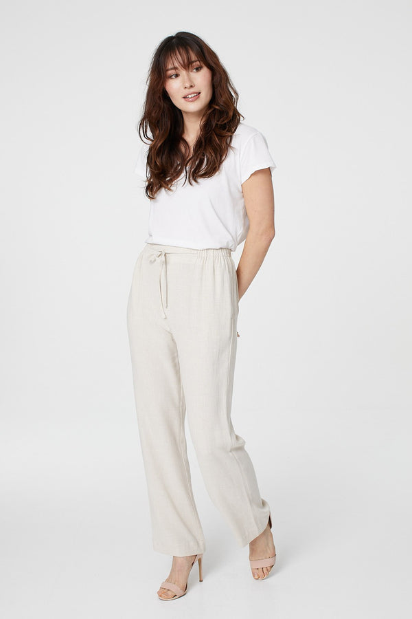 Beige | High Waist Wide Drawstring Trousers : Model is 5'8.5"/174 cm and wears UK8/EU36/US4/AUS8