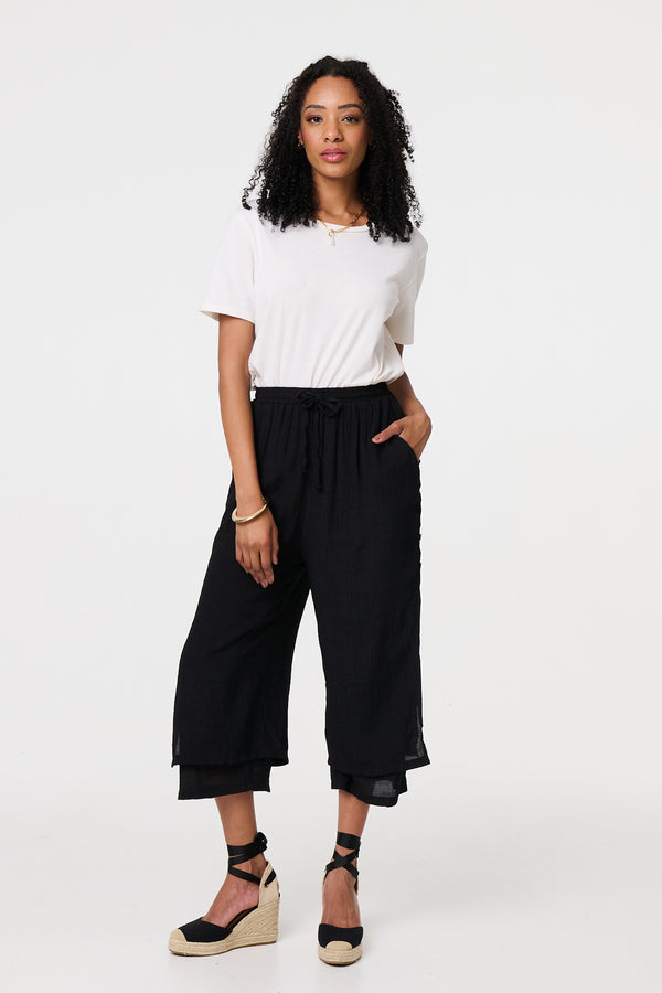 Black | High Waist Layered Hem Cropped Trousers : Model is 5'8"/172 cm and wears UK8/EU36/US4/AUS8