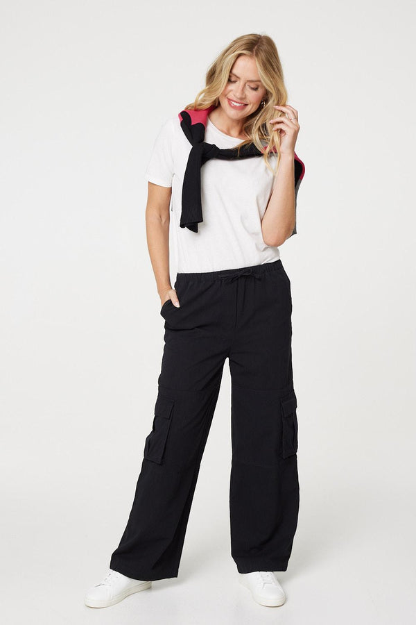 Black | Wide Leg Tie Waist Cargo Trousers : Model is 5'10"/178 cm and wears UK8/EU36/US4/AUS8