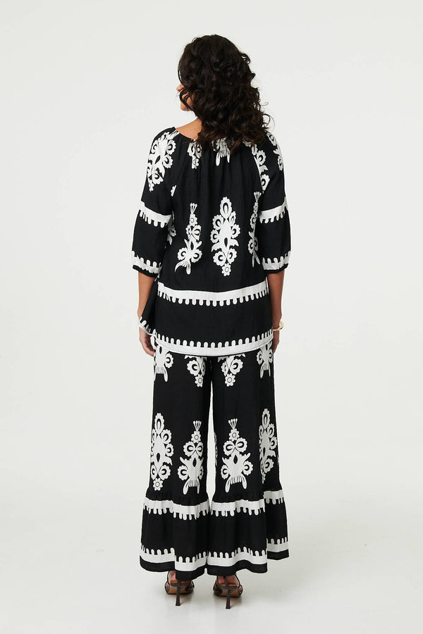 Black | Ikat Print Tassel Tie Neck Blouse