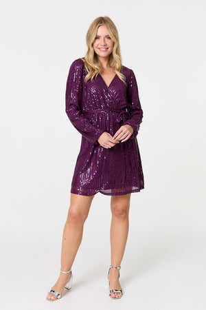 Purple | Sparkly Sequin Long Sleeve Mini Wrap Dress : Model is 5'10