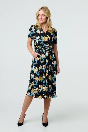 Black | Floral Short Sleeve Faux Wrap Midi Dress : Model is 5'10