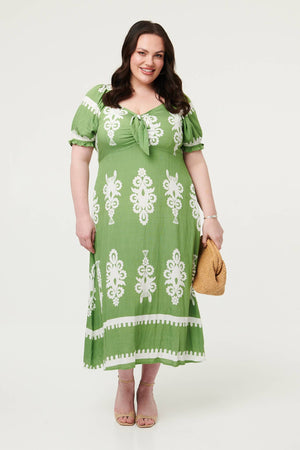 Green | Curve Printed Puff Sleeve Tie Midi Dress : Model is 5'8