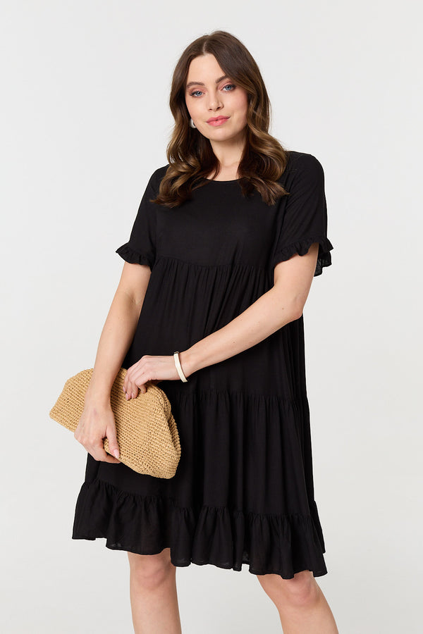 Black | Short Sleeve Frilled Short Smock Dress : Model is 5'9"/175 cm and wears UK8/EU36/US4/AUS8
