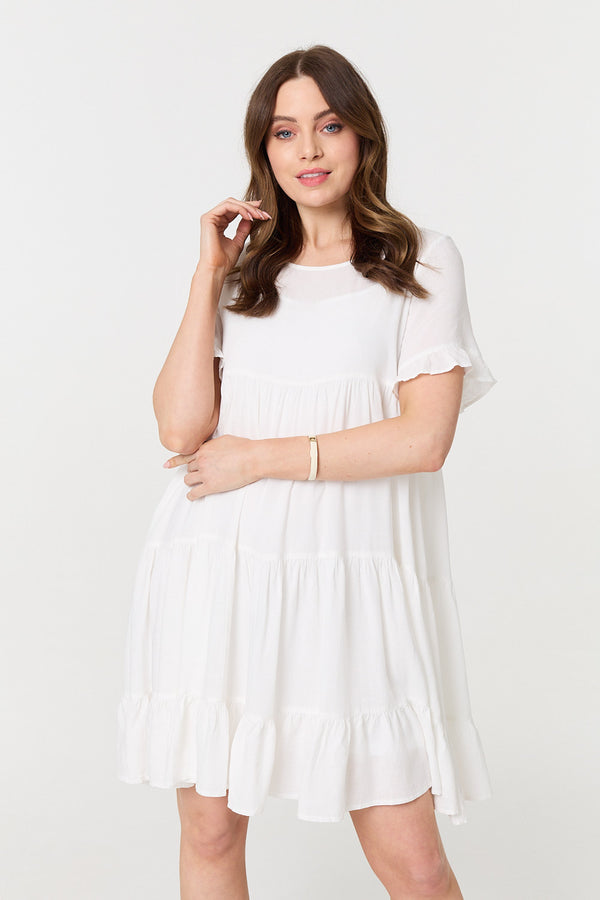 White | Short Sleeve Frilled Short Smock Dress : Model is 5'9"/175 cm and wears UK8/EU36/US4/AUS8
