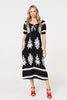 Black | Printed Puff Sleeve Tie Front Midi Dress : Model is 5'10