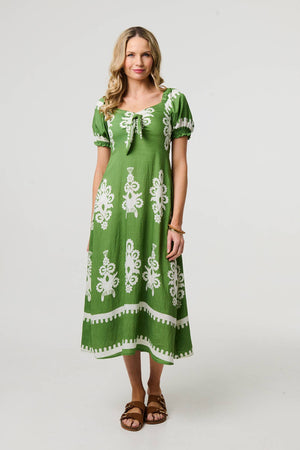 Green | Printed Puff Sleeve Tie Front Midi Dress : Model is 5'10