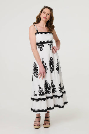 White | Ikat Print Sleeveless A-Line Maxi Dress : Model is 5'9