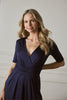 Navy | 1/2 Sleeve Wrap Waist Wide Leg Jumpsuit : Model is 5'10