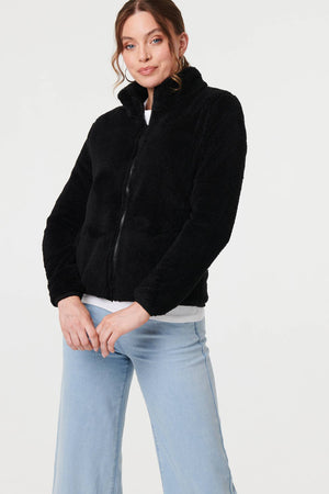 Black | Soft Texture Zip Front High Neck Fleece : Model is 5'9