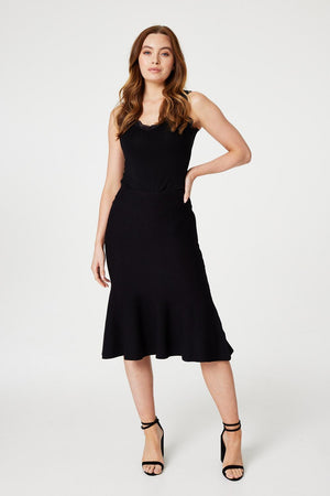 Black | High Waist A-Line Midi Knit Skirt : Model is 5'9"/175 cm and wears UK8/EU36/US4/AUS8