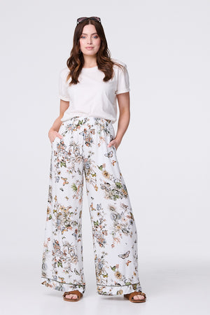 Beige | Butterfly Print High Rise Relaxed Trousers : Model is 5'9