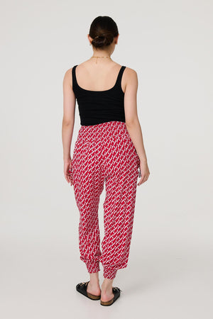 Red | Printed Tapered Harem Trousers