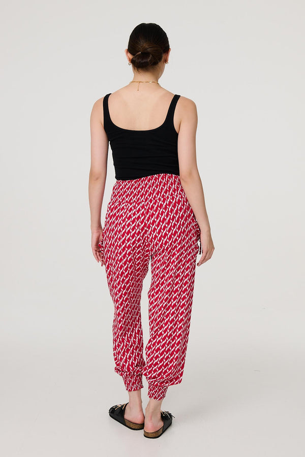 Red | Printed Tapered Harem Trousers