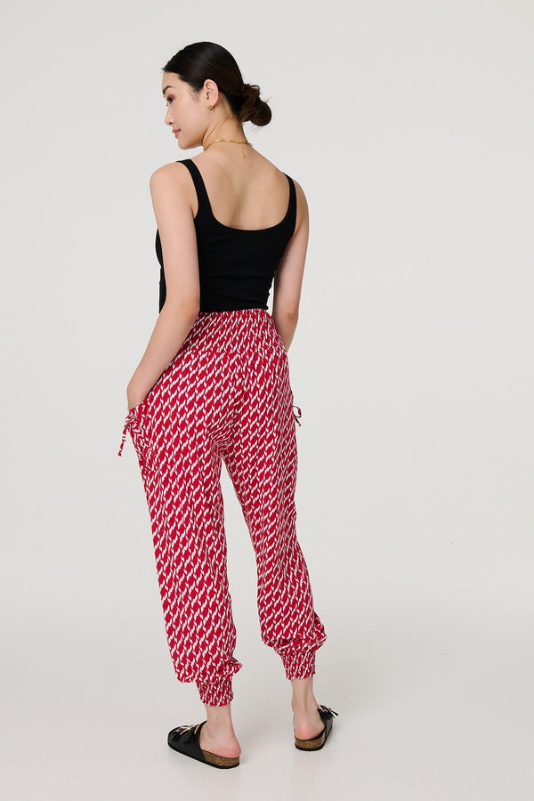 Red | Printed Tapered Harem Trousers