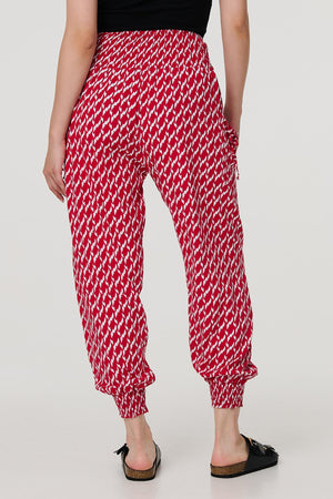 Red | Printed Tapered Harem Trousers