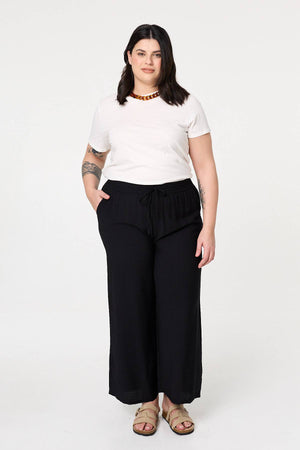 Black | Curve Tie Waist Wide Leg Trousers : Model is 6
