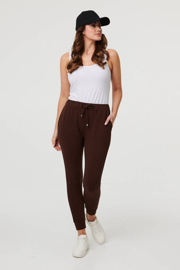 Brown | Adjustable Drawstring Waist Slim Joggers : Model is 5'9"/175 cm and wears UK10/EU38/US6/AUS10