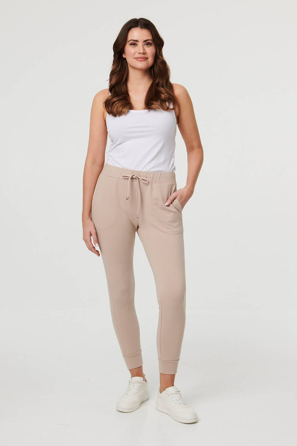 Stone | Adjustable Drawstring Waist Slim Joggers : Model is 5'9"/175 cm and wears UK10/EU38/US6/AUS10