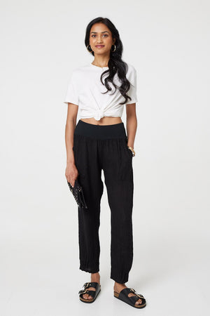 Black | Relaxed Linen Blend Tapered Trousers : Model is 5'8