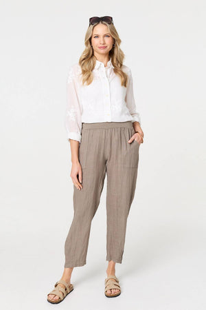 Brown | Relaxed Linen Blend Tapered Trousers : Model is 5'10
