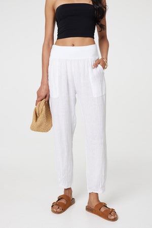 White | Relaxed Linen Blend Tapered Trousers :  Model is 5'8