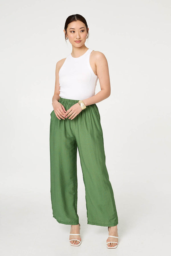 Khaki | Elasticated High Waist Wide Leg Trousers : Model is 5'9"/175 cm and wears UK8/EU36/US4/AUS8