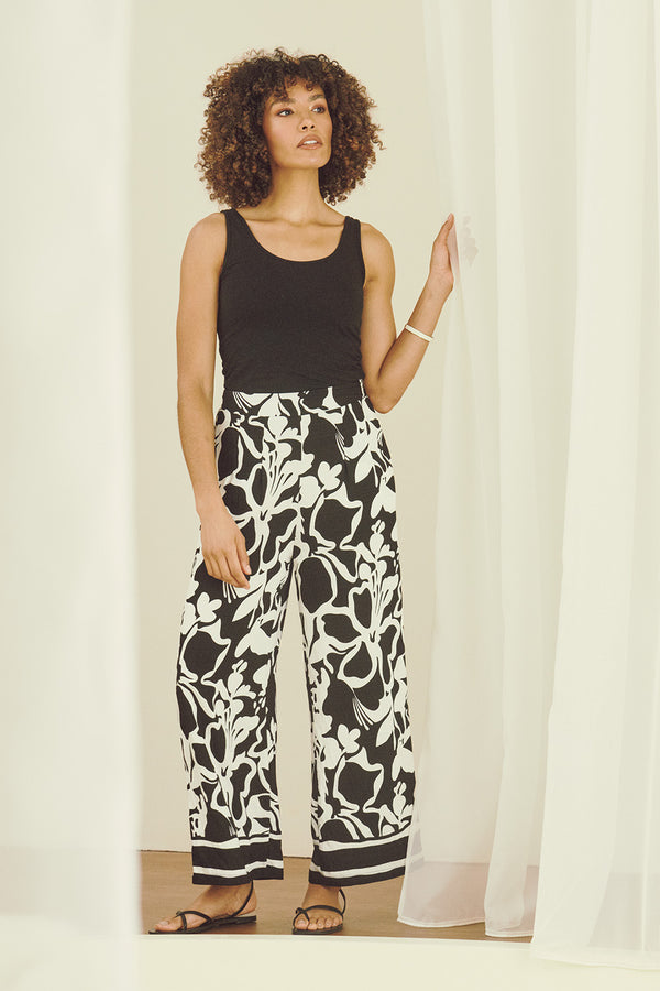 Black | Abstract Floral Wide Leg Trousers : Model is 5'8"/172 cm and wears UK8/EU36/US4/AUS8  