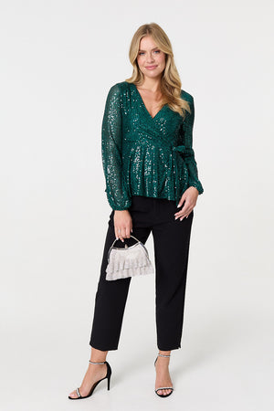 Green | Sequin Embellished Long Sleeve Peplum Top : Model is 5'10