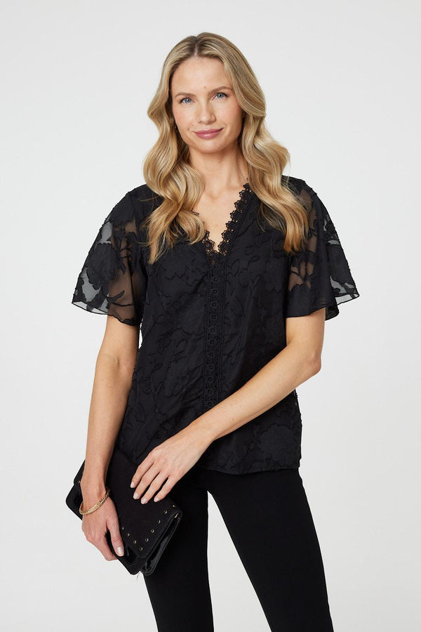 Black| Floral Lace Detail Flared Sleeve Blouse : Model is 5'10"/178 cm and wears UK10/EU38/US6/AUS10