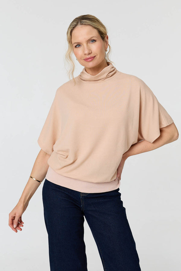 Beige | Roll Neck Button Back Relaxed Knit Top : Model is 5'10"/178 cm and wears UK10/EU38/US6/AUS10