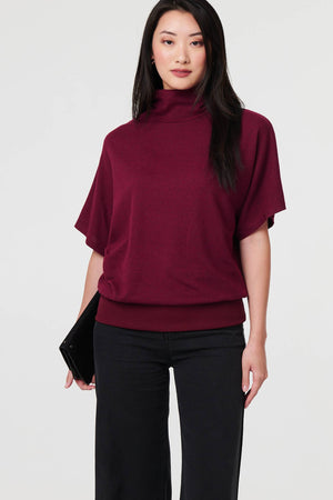 Red | Roll Neck Button Back Relaxed Knit Top : Model is 5'9