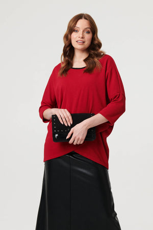 Red | Asymmetric Zip Hem 3/4 Sleeve Tunic Top : Model is 5'9