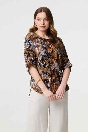 Black | Animal Print 3/4 Sleeve Relaxed Top : Model is 5'9