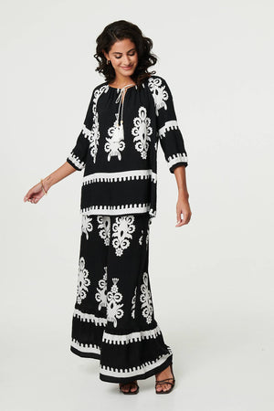 Black | Ikat Print Tassel Tie Neck Blouse
