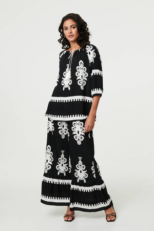 Black | Ikat Print Tassel Tie Neck Blouse
