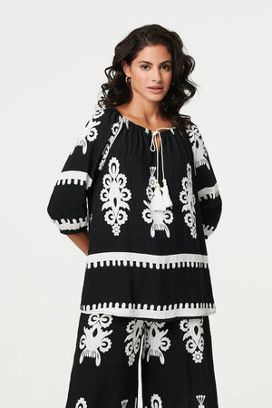 Black | Ikat Print Tassel Tie Neck Blouse
