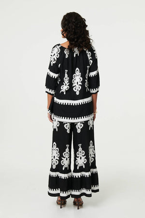 Black | Ikat Print Tassel Tie Neck Blouse
