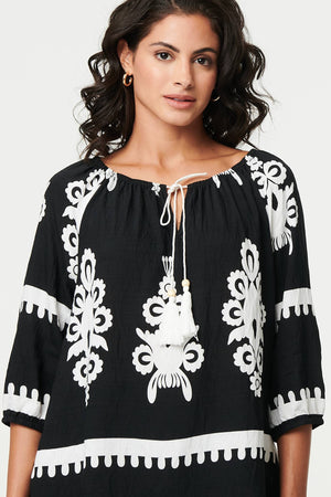 Black | Ikat Print Tassel Tie Neck Blouse
