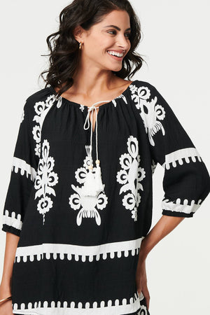 Black | Ikat Print Tassel Tie Neck Blouse
