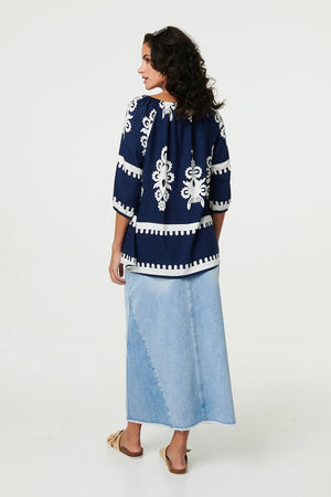 Navy | Ikat Print Tassel Tie Neck Blouse

