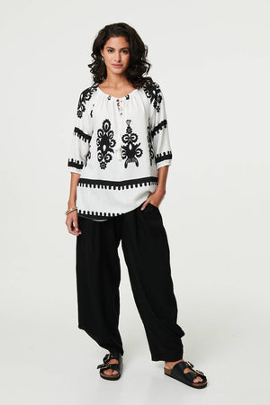 White | Ikat Print Tassel Tie Neck Blouse
