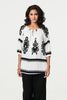 White | Ikat Print Tassel Tie Neck Blouse
