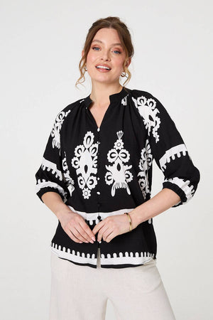 Black | Ikat Print 3/4 Sleeve Relaxed Blouse : Model is 5'10