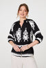 Black | Ikat Print 3/4 Sleeve Relaxed Blouse : Model is 5'10