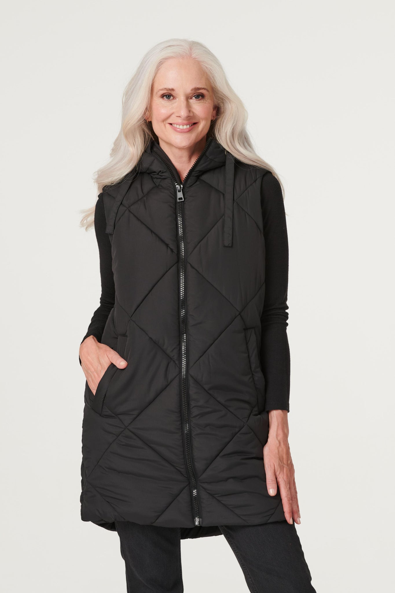 Black | Quilted Longline Puffer Vest : Model is 5'8.5"/174 cm and wears UK8/EU36/US4/AUS8