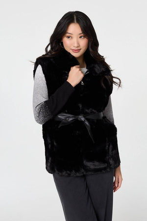 Black | Faux Fur Sleeveless Tie Waist Gilet : Model is 5'9